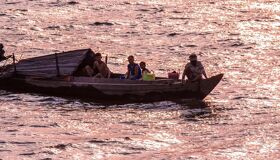 Panoramic view of Chiang Khong’s Mekong shores for a scenic Chiang Khong Tours banner by Legend Travel Group.